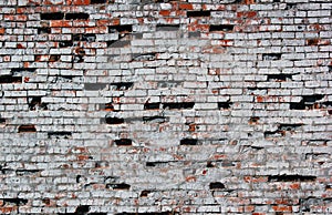 Old destroyed red brick wall painted white texture