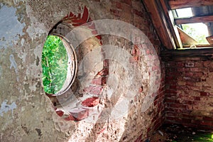 Old destroyed wooden brick attic roof