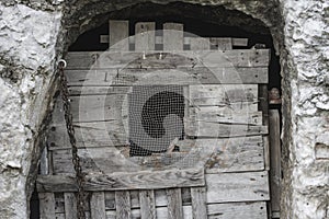 Old destroyed wooden gate in a building