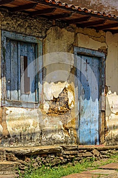 Old and deteriorated house made with rudimentary and ancient construction techniques photo