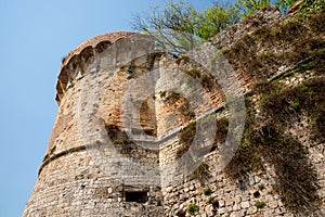 Old deteriorating red bick castle turret