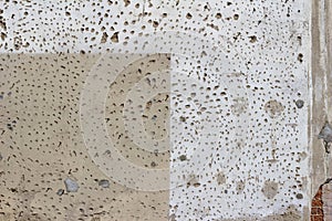 Old deteriorating wall texture showing faded and mottled paint