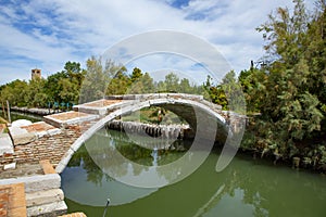 Old devil`s bridge in Torcello