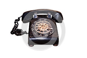 The old dial phone is dirty and scratched isolated