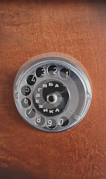 Old dialer on wooden background. technology of yesteryear