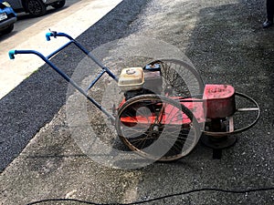 Old diesel lawnmower on the pebbles floor