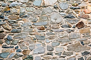 Old, different colors stone wall background texture close up - image