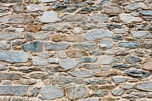 Old, different colors stone wall background texture close up - image