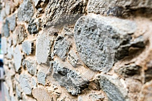 Old, different colors stone wall background texture close up. Selective focus - mage