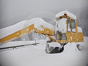 Old digger in the snowdrift