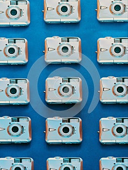 Old digital camera pattern on blue