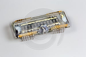 Old digital vacuum fluorescent display on a gray background