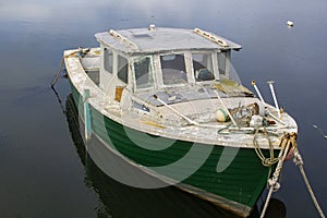 An old dilapidated marine ply cruiser with an inboard diesal eng