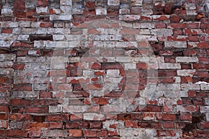 Old dilapidated red brick wall