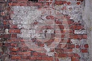 Old dilapidated red brick wall