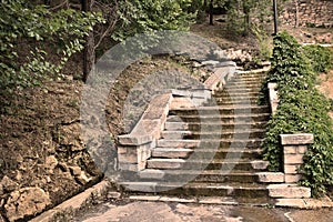 The old dilapidated steps stone stairs in the park