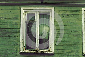 The old dilapidated window frame house