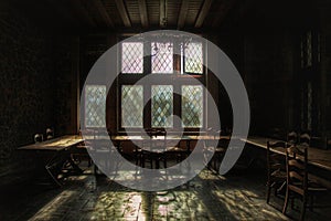 Old diningroom of an abandoned castle left decaying
