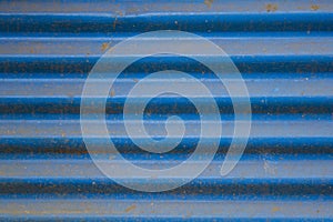 Old dirty blue corrugated metal sheet with rust. rough texture texture