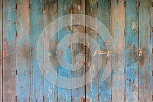 Old and dirty blue wooden door. Wooden door background texture. Wall and door decoration.