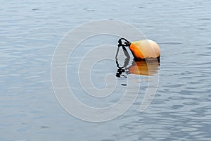 Old dirty buoy in Nissan river in Halmstad, Sweden