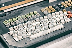 Old dirty computer keyboard with round buttons, closeup fragment. Toning