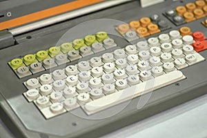 Old dirty computer keyboard with round buttons, closeup fragment