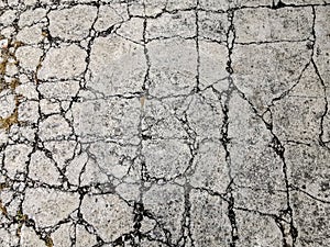 Old dirty cracked concrete wall texture background  road