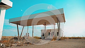 Old dirty deserted gas lifestyle station. U.S. Route 66. crisis road 66 fueling slow motion video. closed supermarket