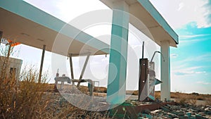 Old dirty deserted gas station. U.S. Route 66. crisis road 66 fueling slow motion video. closed supermarket store shop