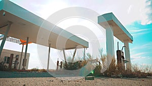 Old dirty deserted gas station. U.S. Route 66. Crisis road 66 fuelling slow motion video. closed supermarket store shop