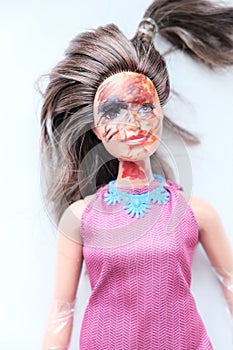 old dirty doll stained with paint