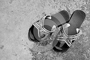 Old and dirty flip flops.