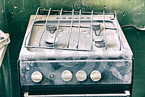Old dirty gas stove in an abandoned state