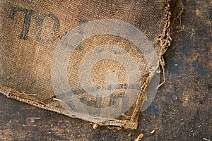 Old dirty hessian sack bag stamped used as upholstery material