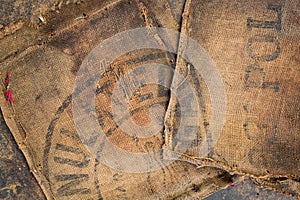 Old dirty hessian sack bag stamped used as upholstery material