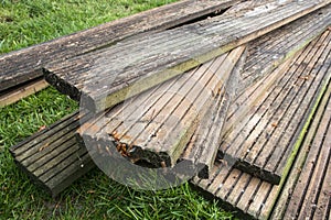 Old dirty reclaimed wooden decking planks