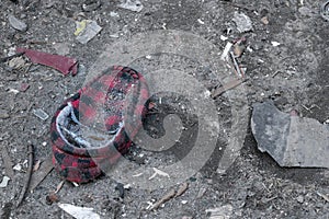 Old, dirty red and black slipper, discarded