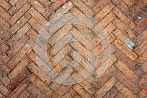 A old dirty red brick parquet. rough surface texture. parquet with stains of paint and dirt