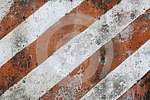 Old and dirty red and white diagona hazard stripes seamless texture