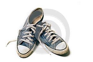 Old & dirty shoes isolated on white background