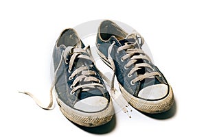 Old & dirty shoes isolated on white background