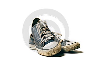 Old & dirty shoes isolated on white background