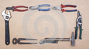 Old dirty tools on wooden background. Construction industry concept