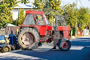 Old and dirty tractor ready for working on field