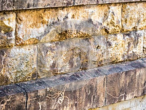 Old dirty weathered Sandstone wall with black stains