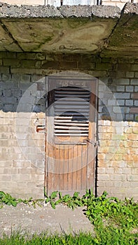 Old dirty wooden door of the privat lager