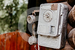 Old disk payphone phone close up