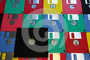 Old diskette 5 25 inches with 3.5 floppy disks of various colors.