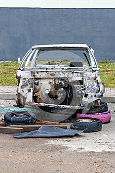 Old dismantled car in landfill